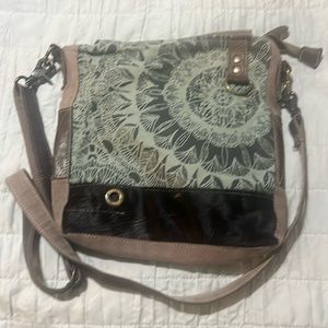 A small, Myra crossbody. Adjustable strap.